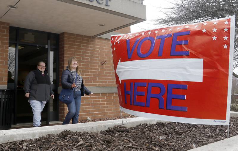 Voters leave McHenry City Hall on Friday, March 31, 2023, after casting their vote in the 2023 consolidated election. Election Day is April 4.