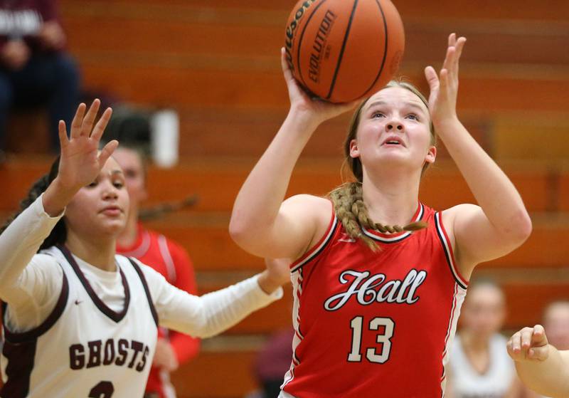 Hall's Caroline Morris eyes the hoop over Illinois Valley Central's Alayah Nelton during the Princeton Holiday Girls Basketball Tournament on Tuesday, Nov. 19, 2024 at Princeton High School.