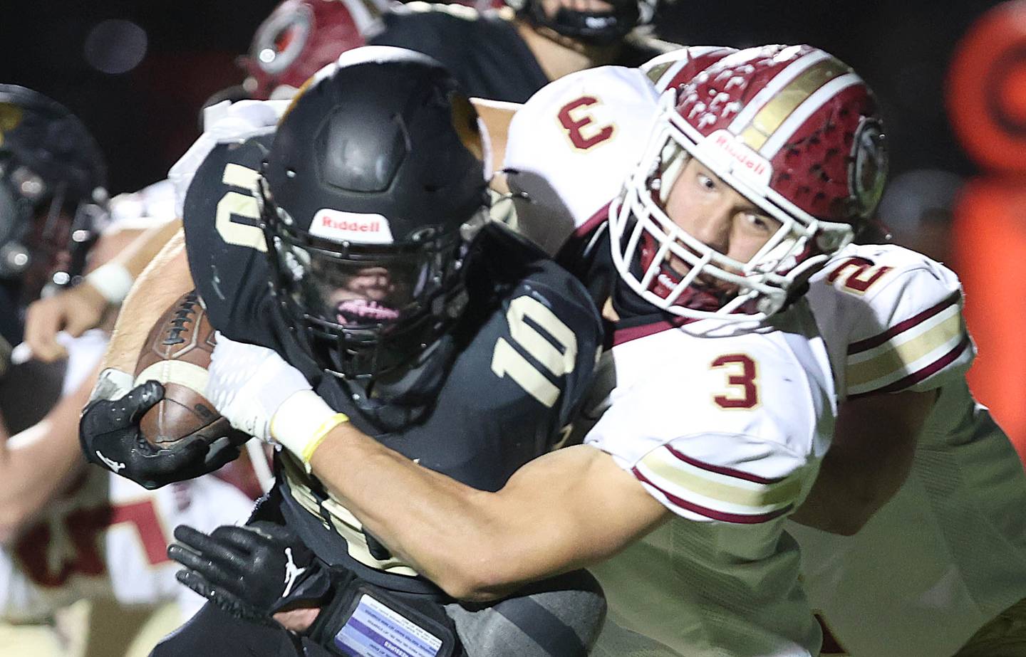 Morris' Sam Reddinger wraps up Sycamore's Zack Crawford during their game Friday, Oct. 21, 2022, at Sycamore High School.