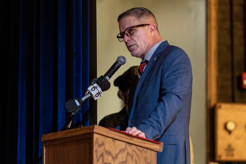 Principal Shad Hallihan delivers opening remarks during the Veterans Day Assembly at Joliet Central High School on Nov. 7, 2025.