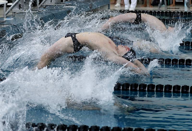 Cary-Grove’s Ignas Venslauskas starts his backstroke as he competes in the 200 medley relay during the  Fox Valley Conference Invitational swim meet on Saturday,  Feb. 15, 2025, at Woodstock North High School.