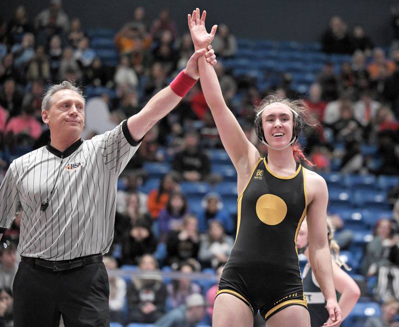 Glenbard North’s Keagan Edwards is declared the winner over Bartlett’s Lilly White in the 130-pound class at the girls wrestling state finals tournament at Grossinger Arena in Bloomington on Saturday, Feb. 28, 2026.