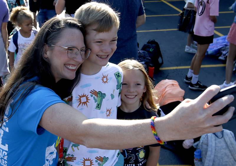 Teacher Amanda Hall takes a ‘selfie” with her two children, Merrill, 10, and Ellis, 7, on first day of school at West Elementary School in Crystal Lake on Wednesday, Aug. 16, 2023.
