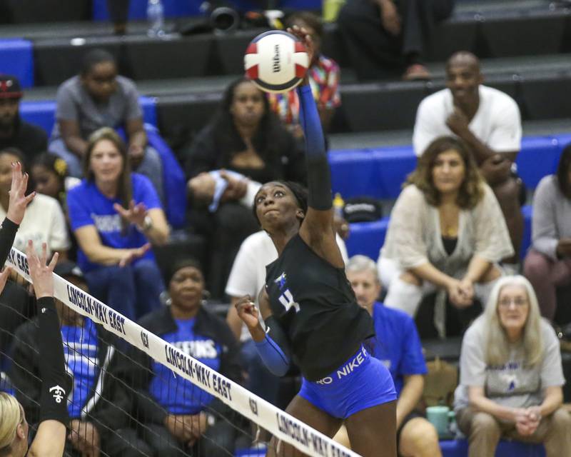 Lincoln-Way East's Klarke Mosby (4) hits a kill shot during volleyball match between Lockport at Lincoln-Way East. Oct 14, 2025.