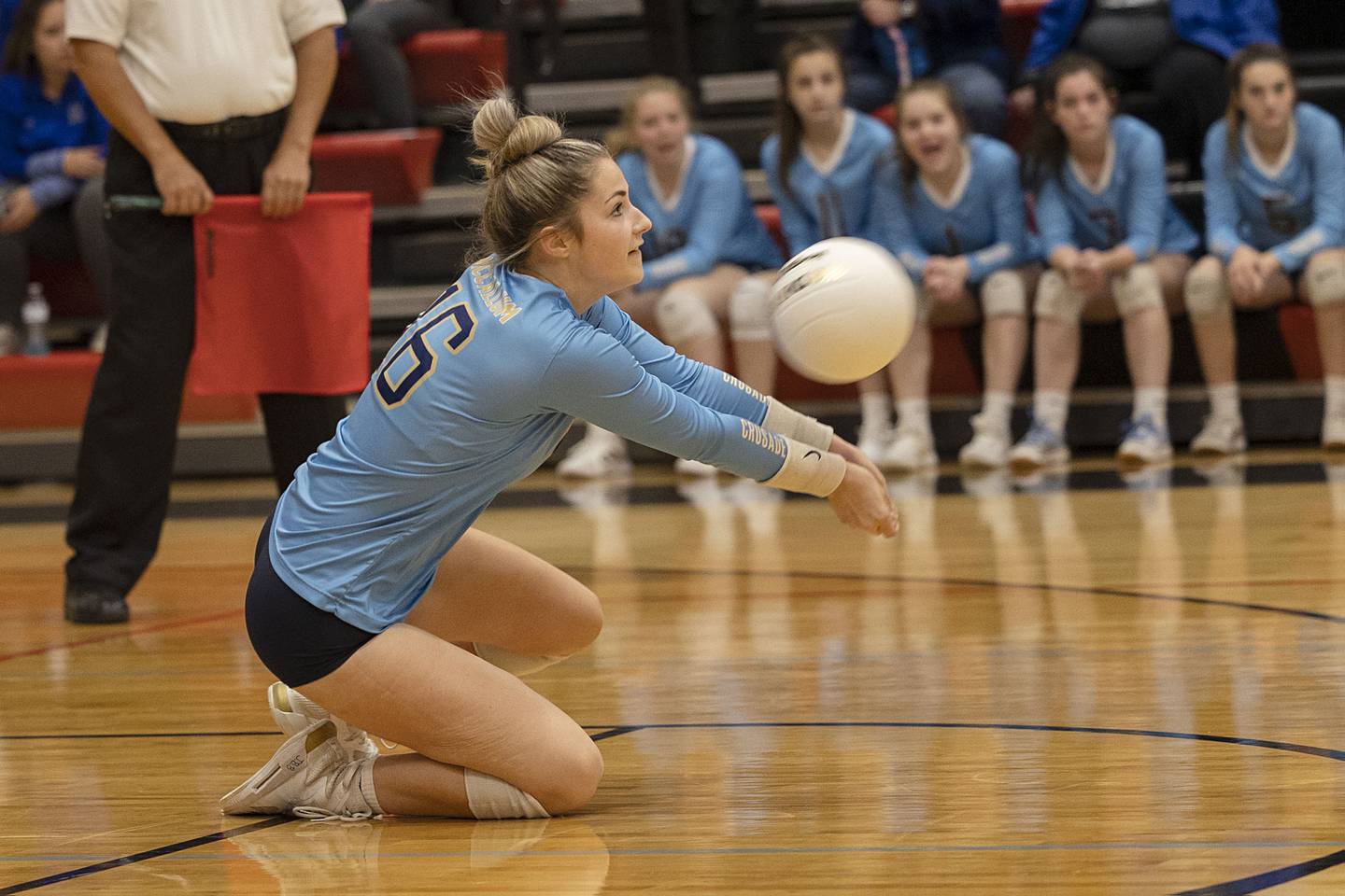 Ottawa Marquette’s Eva McCallum digs the ball in game one of the Crusader’s sectional semifinal Monday, Oct. 31, 2022 against River Ridge.