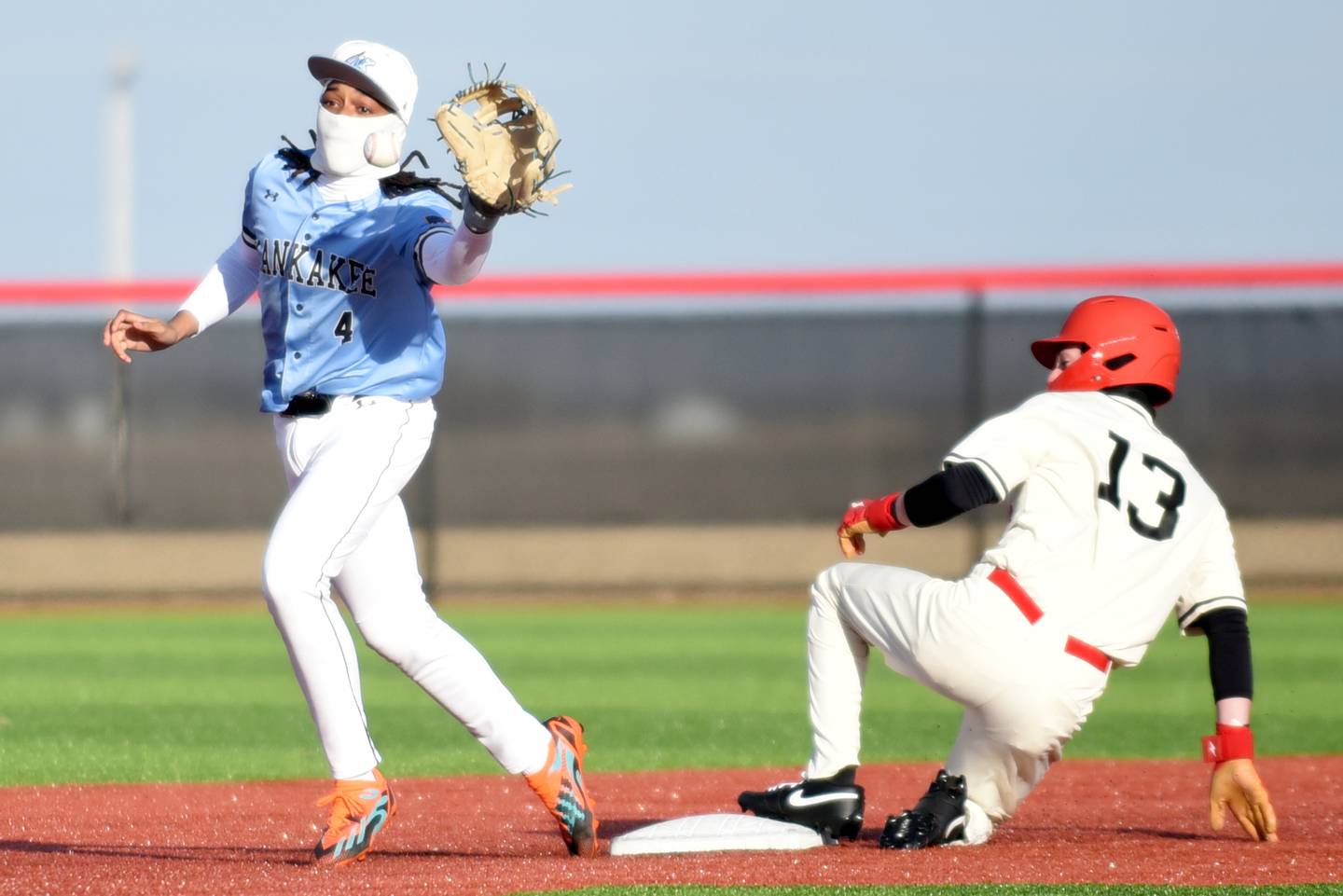 Kankakee's Mike Prude, left, fields a late throw at second as Bradley-Bourbonnais' Trenton Burge slides in during a game at 315 Sports Park in Bradley Friday, March 27, 2026.