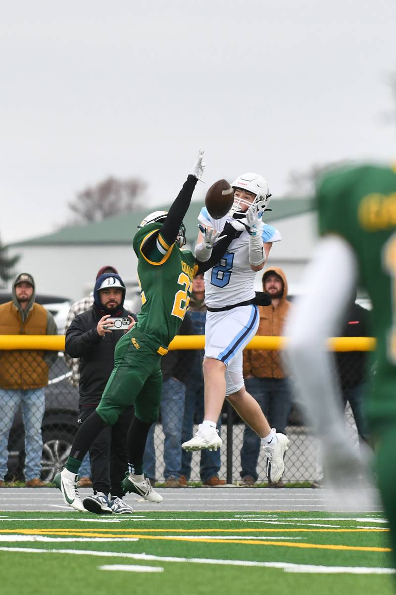 DePaul's Matthew Osterman catches a first down as Coal City's Noah Houston tries to deflect the ball on Saturday, Nov. 23, 2024, during the Rams' 21-14 victory over the Coalers in the IHSA Class 4A Playoffs semifinal game.