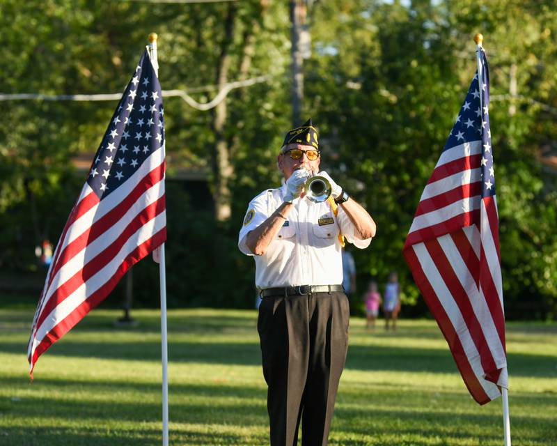 Michael Embrey, Illinois Veteran of the Year and USAF Veteran, plays taps on Sunday Sep. 3, 2023, during the opening ceremonies of Field of Honor at Denning Park in La Grange.