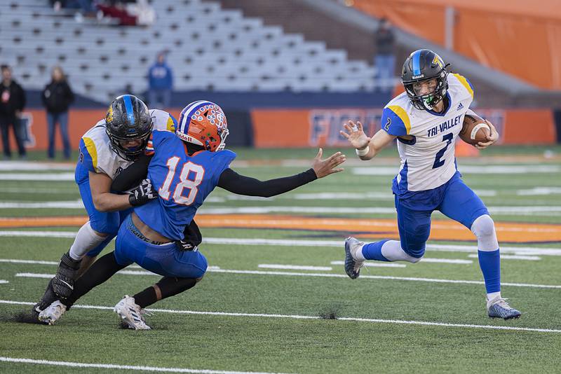 Tri-Valley’s Andy Knox picks up yards against St. Teresa Decatur in the class 2A IHSA football state championship game Friday, Nov. 25, 2022.