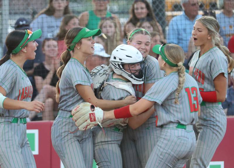 Members of the L-P softball team (from left) Anna Riva, Dangy Greer, Mackenzie Chamberlain, Taylor Vescogni, Shayla Turczyn, and Kelsey Frederick gather around home plate to celebrate their 2-0 win over East Peoria during the Class 3A Sectional semifinal game on Tuesday, May 26, 2026 at the L-P Athletic Complex in La Salle.