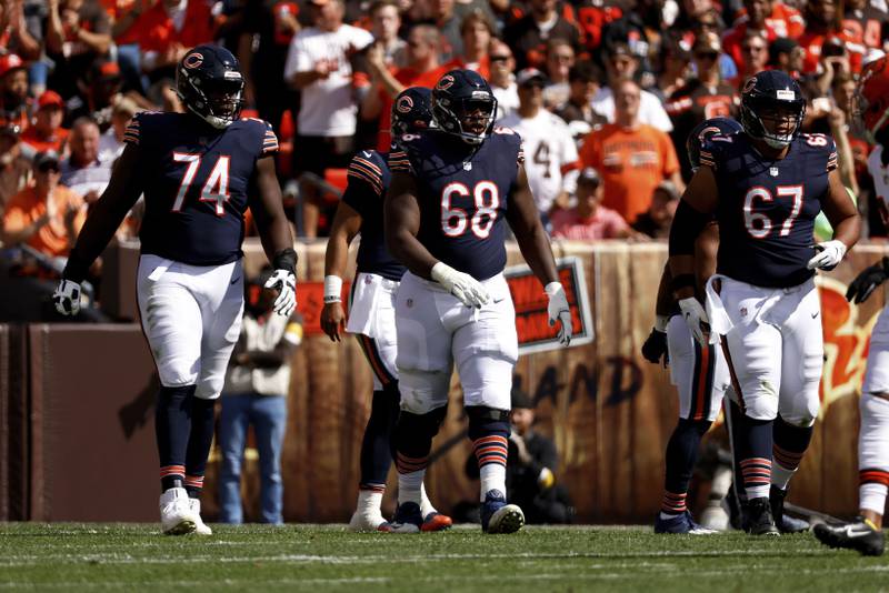 Chicago Bears guard Germain Ifedi (74), guard James Daniels (68), and center Sam Mustipher (67) walk up to the line of scrimmage during an NFL football game against the Cleveland Browns, Sunday, Sept. 26, 2021, in Cleveland.