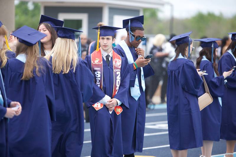 Downers Grove South graduates lining up for the Commencement Ceremony on Sunday, May 18, 2025 in Downers Grove.