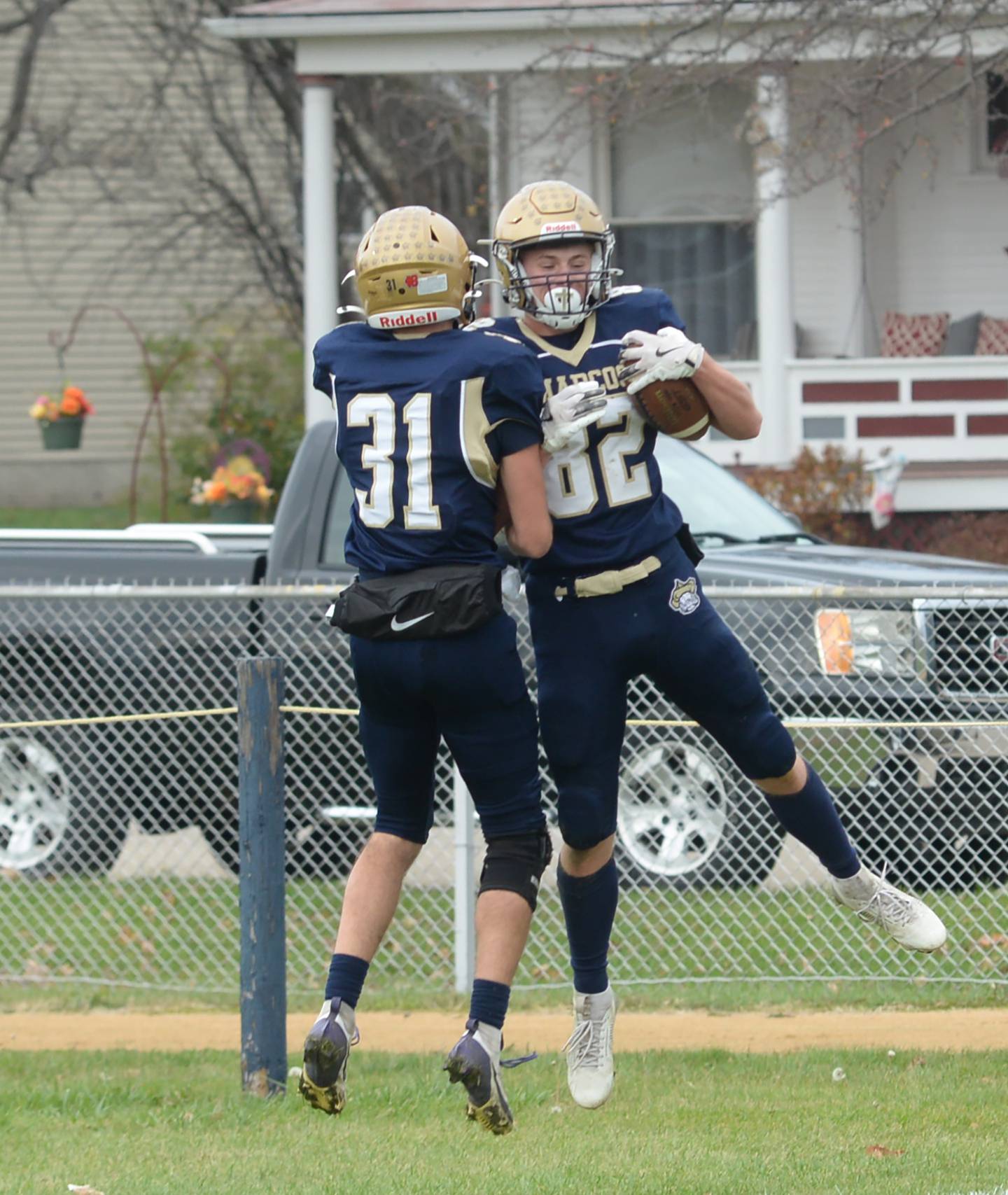 Polo's Kalin Gulbranson (82) and Noah Dewey (31) celebrate a touchdown against West Carroll during 8-man football playoff action on Saturday, Nov. 9, 2024 at Polo High School.