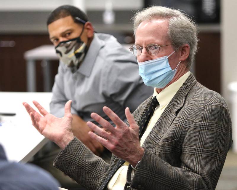 DeKalb City Manager Bill Nicklas speaks as Human Relations Commission member John Walker looks on Tuesday during the Human Relations Commission Meeting at the DeKalb Police Department.