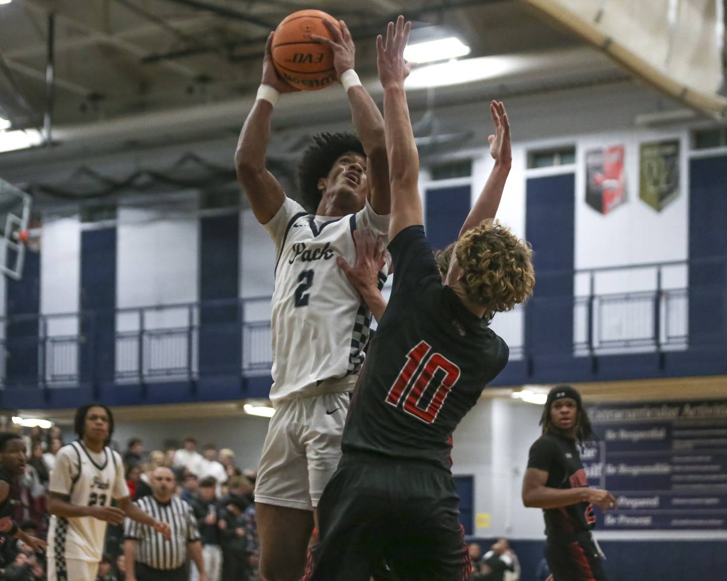 Oswego East's Jacsen Tucker (2) puts up a shot from the post during their basketball game between Yorkville at Oswego East. Friday, Dec 19, 2025 in Oswego.