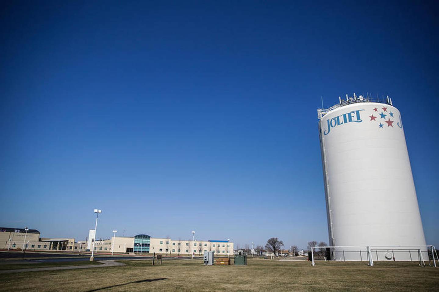 A Joliet water tower stands next to Plainfield South High School, Wednesday, April 1, 2015, in Joliet, Ill.