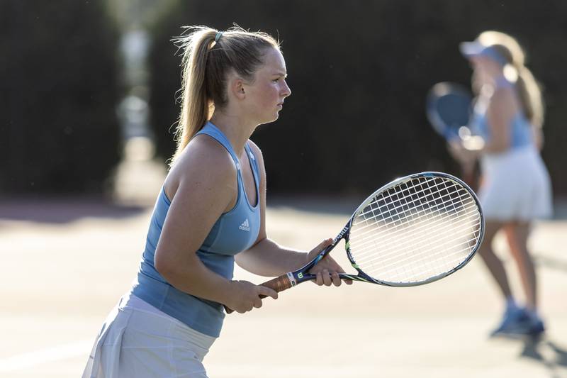 Joliet Catholic Academy’s Addison Allen competes in varsity doubles tennis during a match against Joliet Township at Joliet West on Sept. 29, 2025.