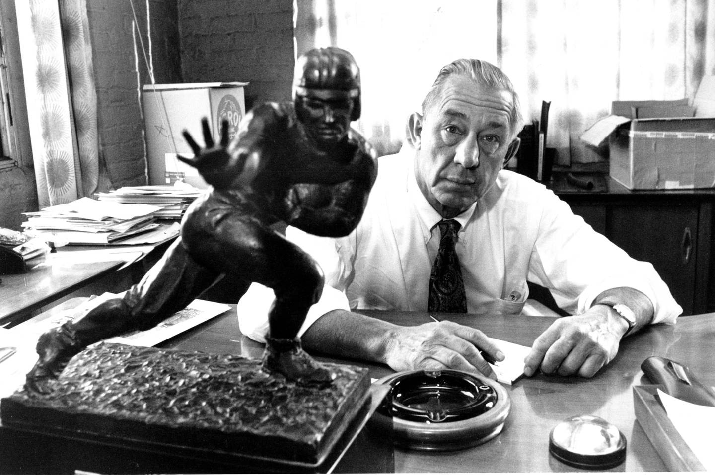 The first Heisman trophy winner, Jay Berwanger, poses at his office in Chicago on Dec. 13, 1972.