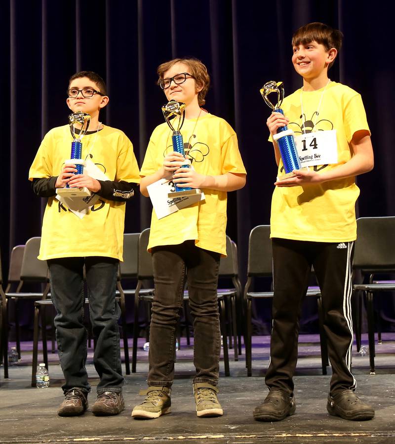 Third place winner Hunter Mullins (left), second place winner Graham Butler (center) and first place winner Benjamin Hills (right) following the Kaneland School District 302 Spelling Bee on Tuesday, Jan. 14, 2025 at Kaneland High School in Maple Park.