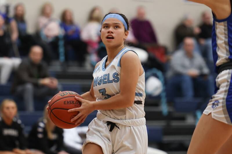 Joliet Catholic’s Elena Czerkies goes in for the basket against St. Francis on Monday, February 6th, 2023.