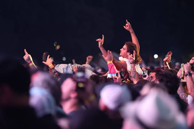 A fan crowd surfs during Turnstile’s performance on the Roots Stage on day one of Riot Fest, Friday, Sept. 15, in Chicago.