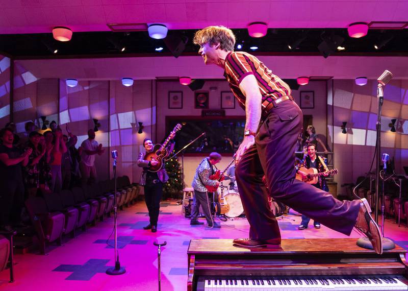 Garrett Forrestal (center) plays Jerry Lee Lewis in Million Dollar Quartet, the inaugural production at Paramount Theatre’s new Stolp Island Theatre, 5 E. Downer Place, Suite G, in downtown Aurora. Performances have already been extended through December 29, 2024 due to popular demand. Also pictured (behind, from left): Bill Scott Sheets as Johnny Cash, Christopher Wren as Carl Perkins and Alex Swindle as Elvis Presley. Tickets: paramountaurora.com or (630) 896-6666. Credit: Liz Lauren