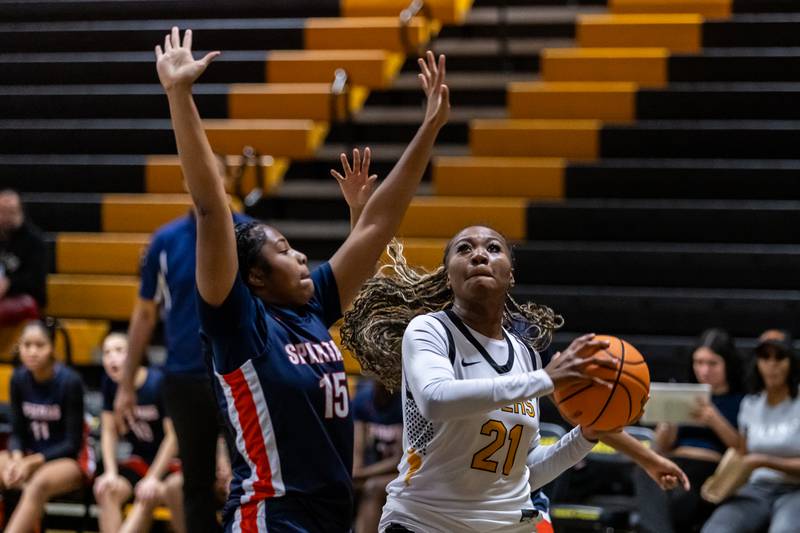 Joliet West's Jada Thompson drives to the basket during a varsity girls basketball game against Romeoville at Joliet West on Dec. 11, 2025.