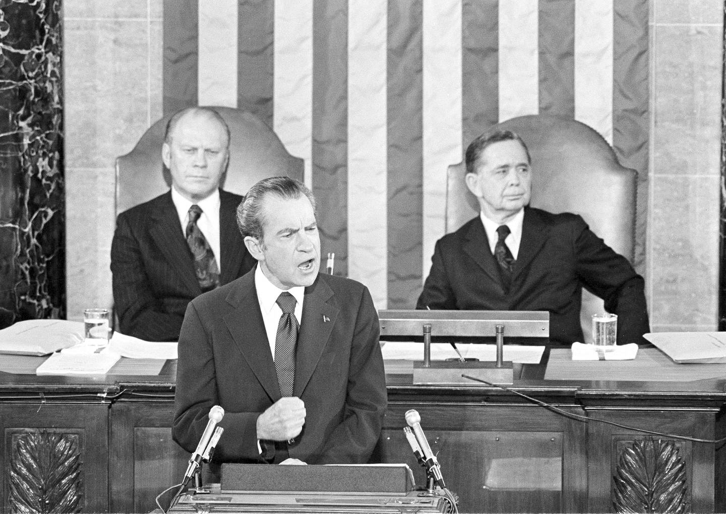 In this Jan. 30, 1974, file photo, Vice President Gerald Ford and House Speaker Carl Albert listen to President Richard Nixon deliver his State of the Union address to a joint session of Congress in Washington.