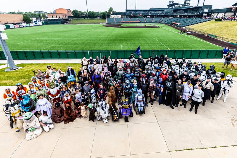 Participants of Joliet Public Library's Star Wars Day Parade pose for a group photo at Duly Health And Care Field on June 7, 2025.