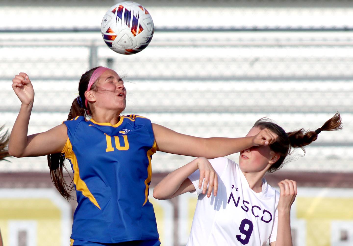 Johnsburg’s London Baidinger, left, battles North Shore Country Day’s Alexia Conine for the ball  in IHSA Class 1A Sectional Title Game action at Richmond-Burton High School in Richmond on Tuesday, May 27, 2025.