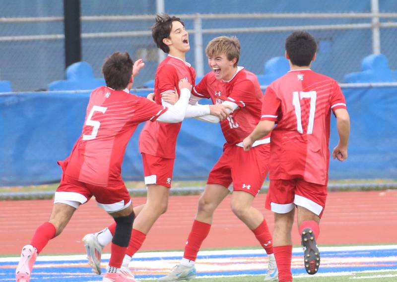 Hindsdale Central players (from left) Michael DiTomasso, Kristof Dani, Matt Gantar and Antonio Azzo celebrate after Dani scored a goal against Edwardsville during the Class 3A State third place game on Saturday, Nov. 9, 2024 at Hoffman Estates HIgh School.