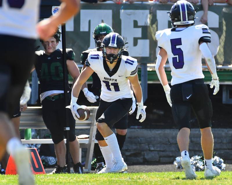 Downers Grove North's Charlie Cruse (11) reacts after making an interception during a game against Glenbard West on Sep. 9, 2023 at Glenbard West High School in Glen Ellyn.
Jon Cunningham for Shaw Local News Network