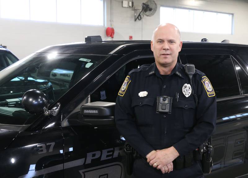 Peru Police officer Bill Sommer poses for a photo on Tuesday, March 26, 2024 at the City of Peru Safety Complex.