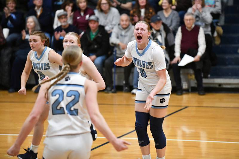 Cissna Park's Addison Lucht celebrates with teammate Josie Neukomm (22) as the Timberwolves force a Watseka-Milford timeout in the first quarter on Monday, Feb. 10, 2025, during the Timberwolves' 61-40 victory.