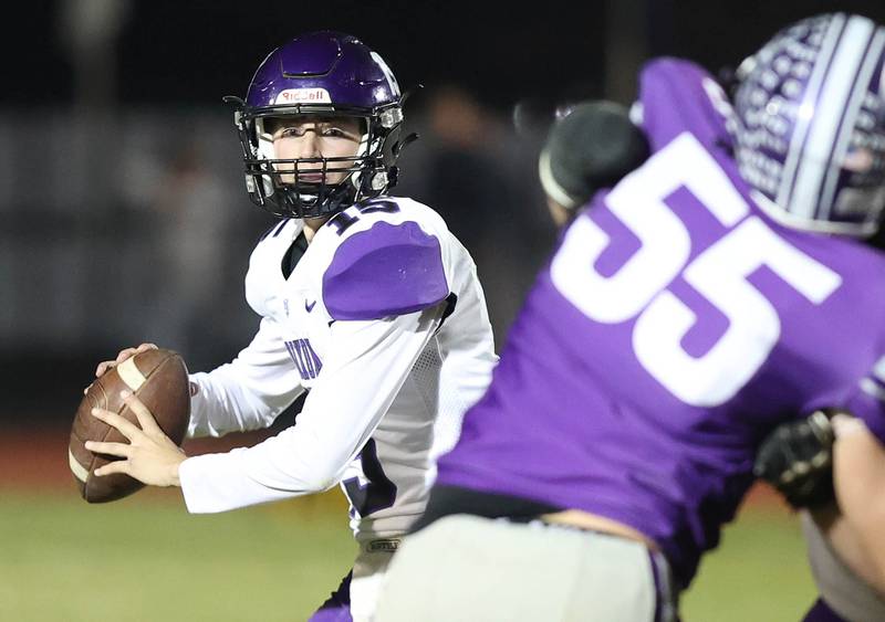 Dixon quarterback Tyler Shaner looks for a receiver during their first round playoff game against Rochelle Friday, Oct. 28, 2022, at Rochelle High School.