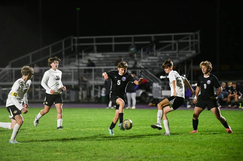 Manteno’s Kash Goranson takes a touch toward the goal as Herscher’s Bryson Schultz turns to defend Tuesday during this season’s game.