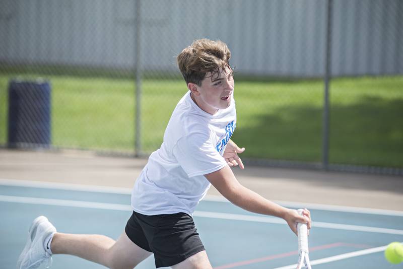 Owen Winters returns a shot while playing in the 15 and under boys single tournament during the Emma Hubbs tennis classic in Dixon.