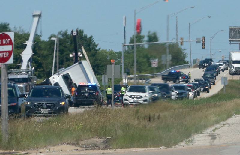 Crews work the scene of a semi truck crash on Friday, June 14, 2024 near the intersection of 38th Street and Illinois 251 in Peru. A Goodwill semi truck overturned and extrication was needed. The crash happened shortly before 11:30a.m. Illinois Route 251 was down to one lane. Peru police believe injuries were not serious.