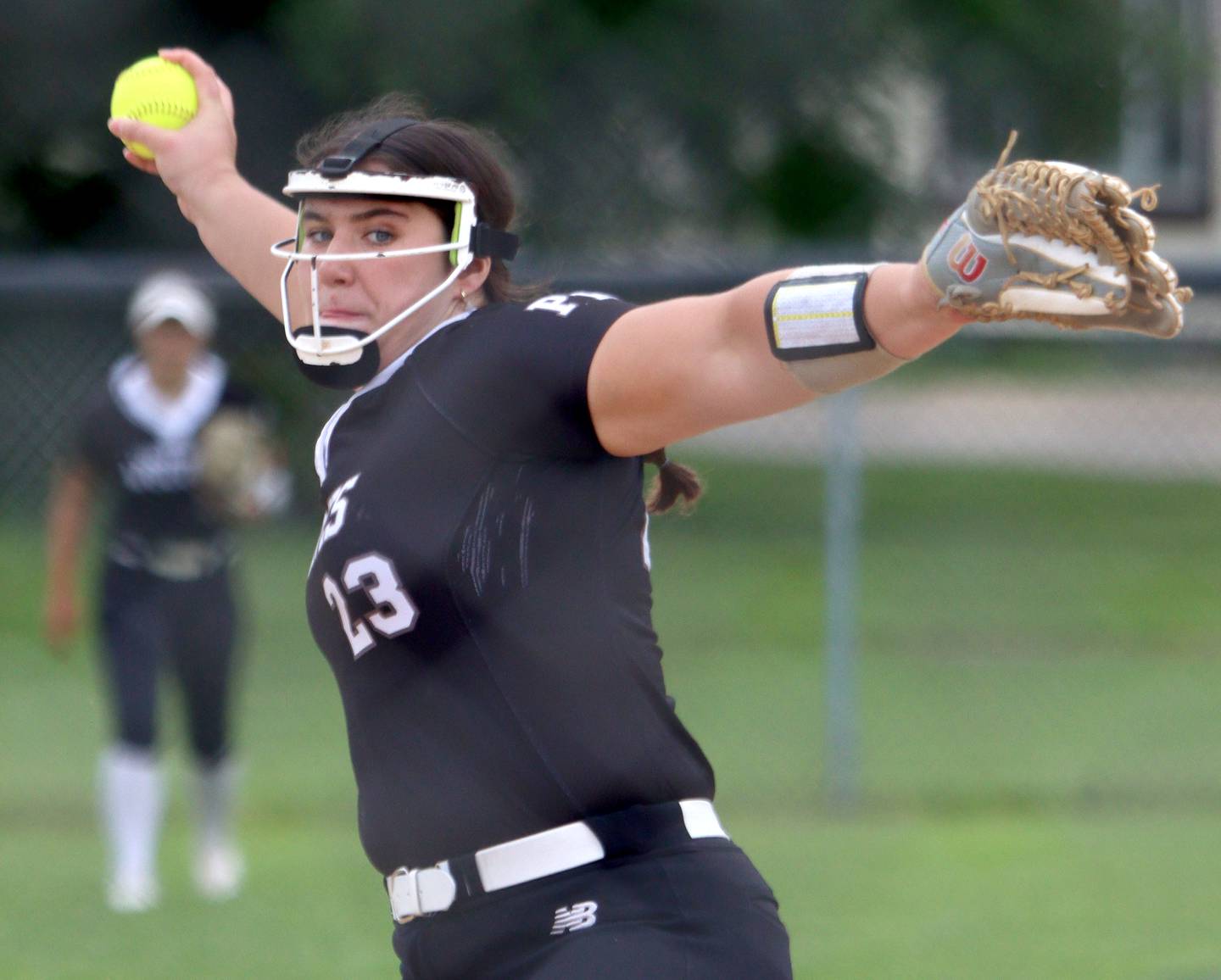 Prairie Ridge’s Reese Mosolino fires toward home against Harvard during Class 3A softball regional final action at Lions Park in Harvard Friday.