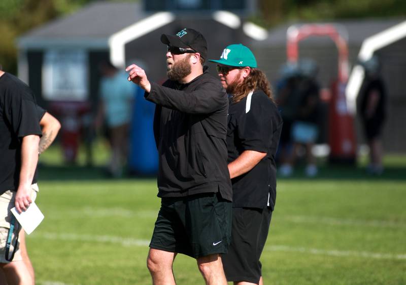 Woodstock North Head Coach Jeremiah Homuth looks on during a 7 on 7 football tournament on Tuesday, July 15, 2025 at Kaneland High School in Maple Park.