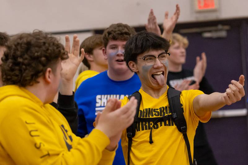 Fan Kainoa Ancog celebrates a three point basket by Johnsburg High School during the IHSA 2A Sectional Championship game on March 6, 2026 at Mendota High School.