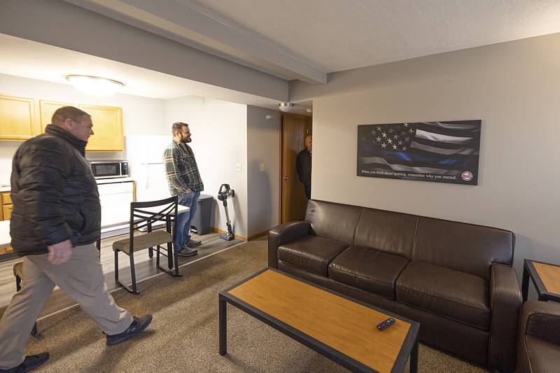 Visitors tour an apartment in Sauk Valley College’s Police Academy housing unit during an open house Tuesday, Dec. 13, 2022.