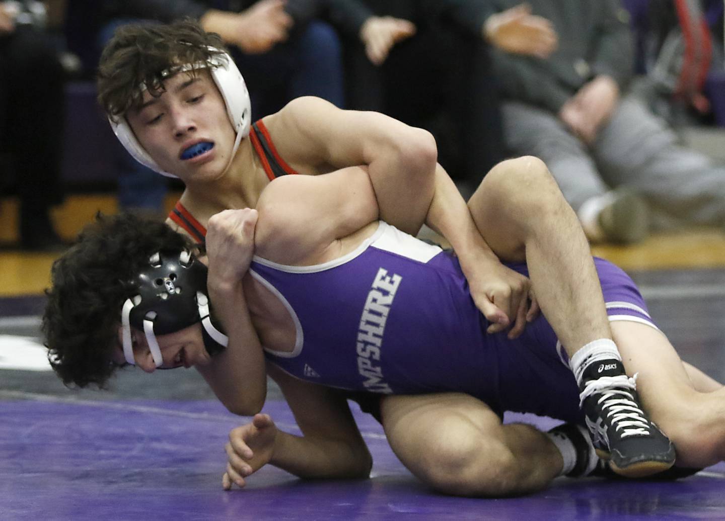 Huntley's Colin Abordo controls Hampshire's Deegan Kirschke during the 113-pound match of a Fox Valley Conference wrestling meet on Wednesday, Jan. 8, 2025, at Hampshire High School.
