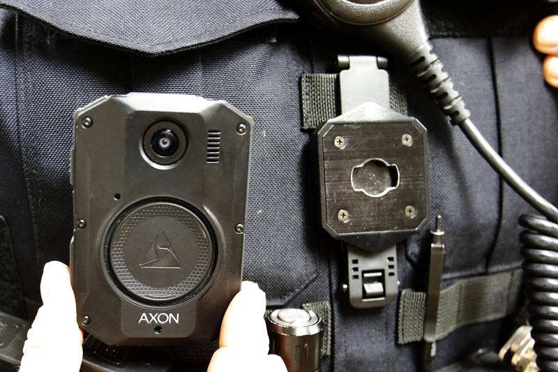 A police officer is seen with a body camera on Tuesday, Dec. 14, 2021.