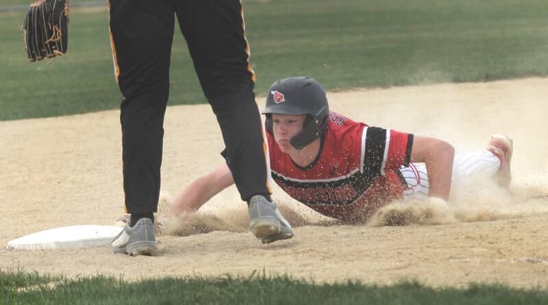 Forreston's Brendan Greenfield slides safely into third base during a Monday, April 28, 2025 game with Lena-Winslow at Forreston High School.