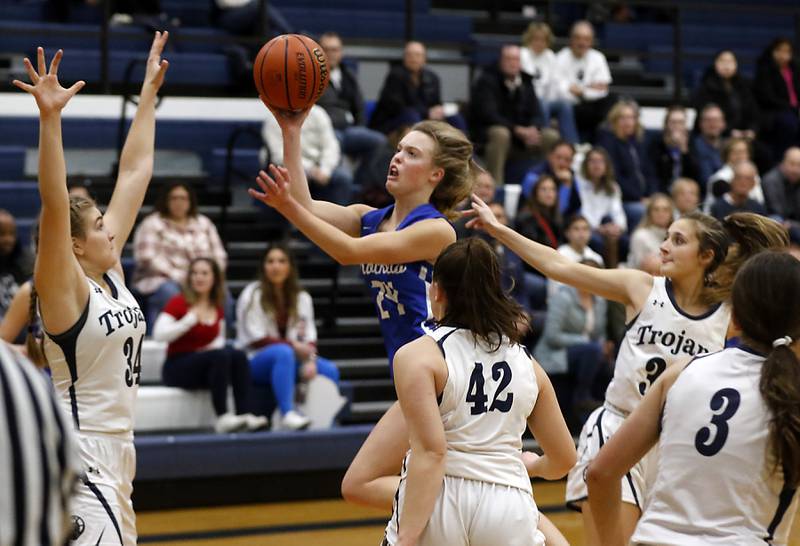 Burlington Central's Page Erickson drives the lane agains the \Cary=Grove defense during a Fox Valley Conference girls basketball game Friday Jan. 6, 2023, at Cary-Grove High School in Cary.