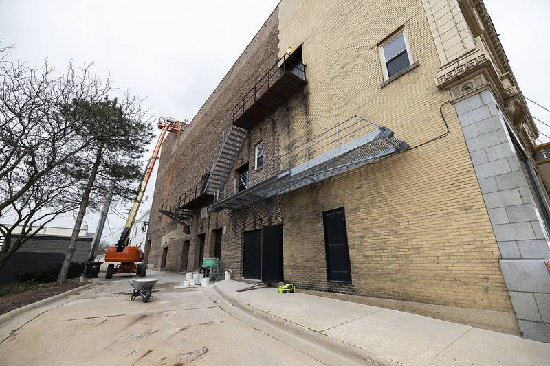 Workers prepare The Dixon: Historic Theatre on Monday, Nov. 25, 2024, for the pre-fab roof  to be put into place.
