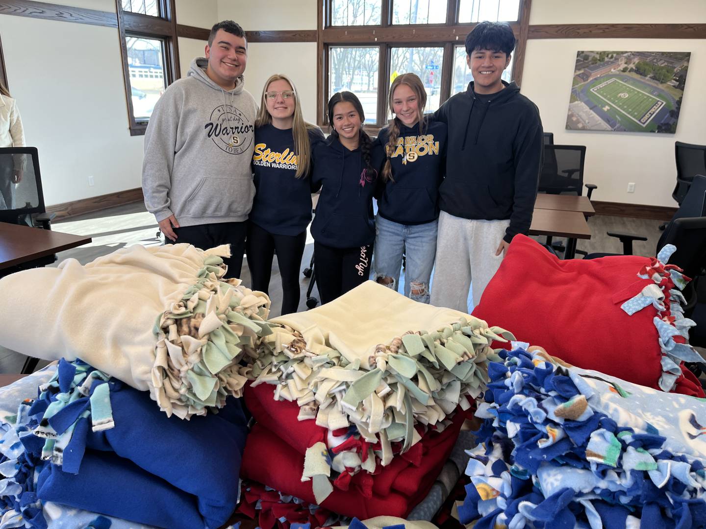 Sterling Key Club students made tie blankets for CGH Medical Center's labor and delivery patients. Pictured (from left) are Gavin Fischer, Madison Birdsley, Emma Pham, Brenner Thompson and Josue Grande.