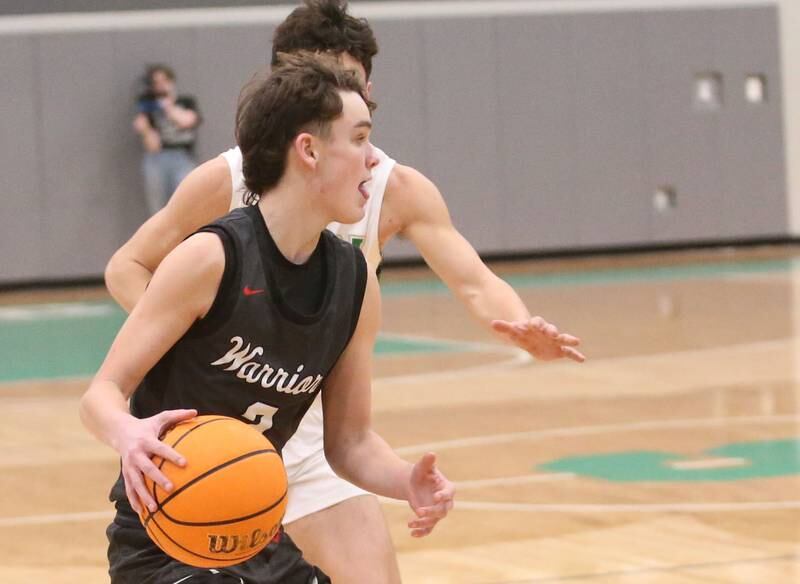 Woodland's Nolan Price looks to get around a Seneca defender on Friday, Feb. 14, 2025 at Seneca High School.
