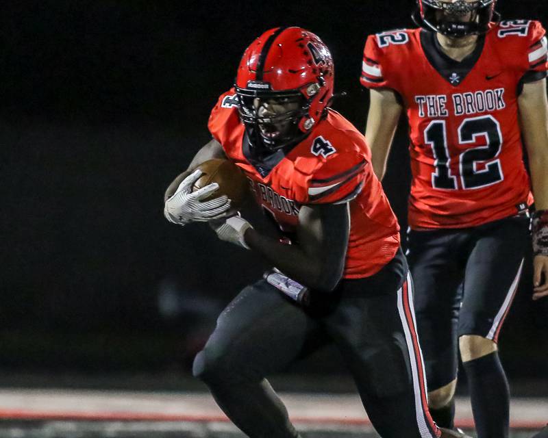 Bolingbrook's Timmie Lewis II (4) runs up the middle during a football game between Oswego at Bolingbrook on Friday, Oct 4th, 2024  in Bolingbrook.